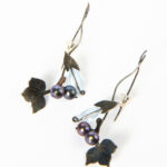 The earrings with topaz and river pearl